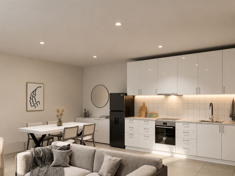 Sala e cozinha da fração F em open space, com mesa de refeições