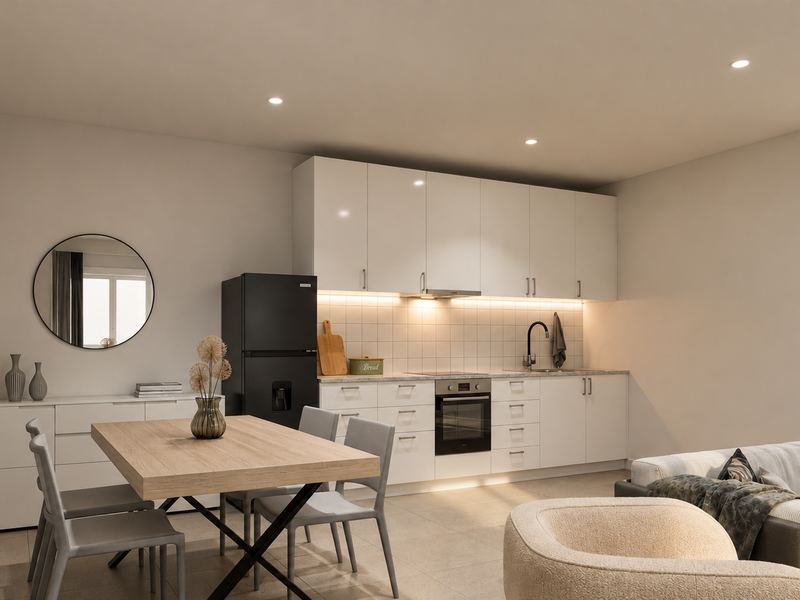 Sala e cozinha da fração F, com mesa de madeira e cozinha ao fundo
